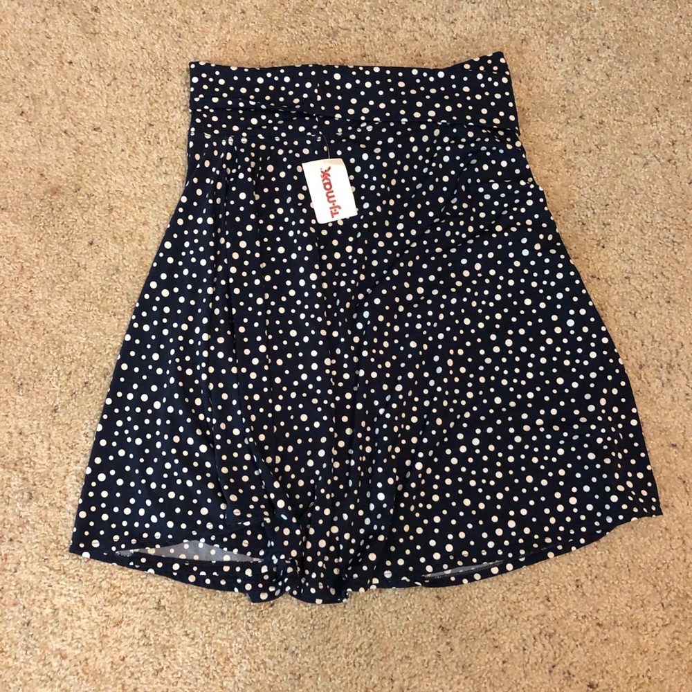 Navy blue polka dot skirt with slight ruffle band
